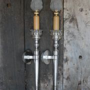 Large pair of silver-plated wall lights with flame globes, torches.
