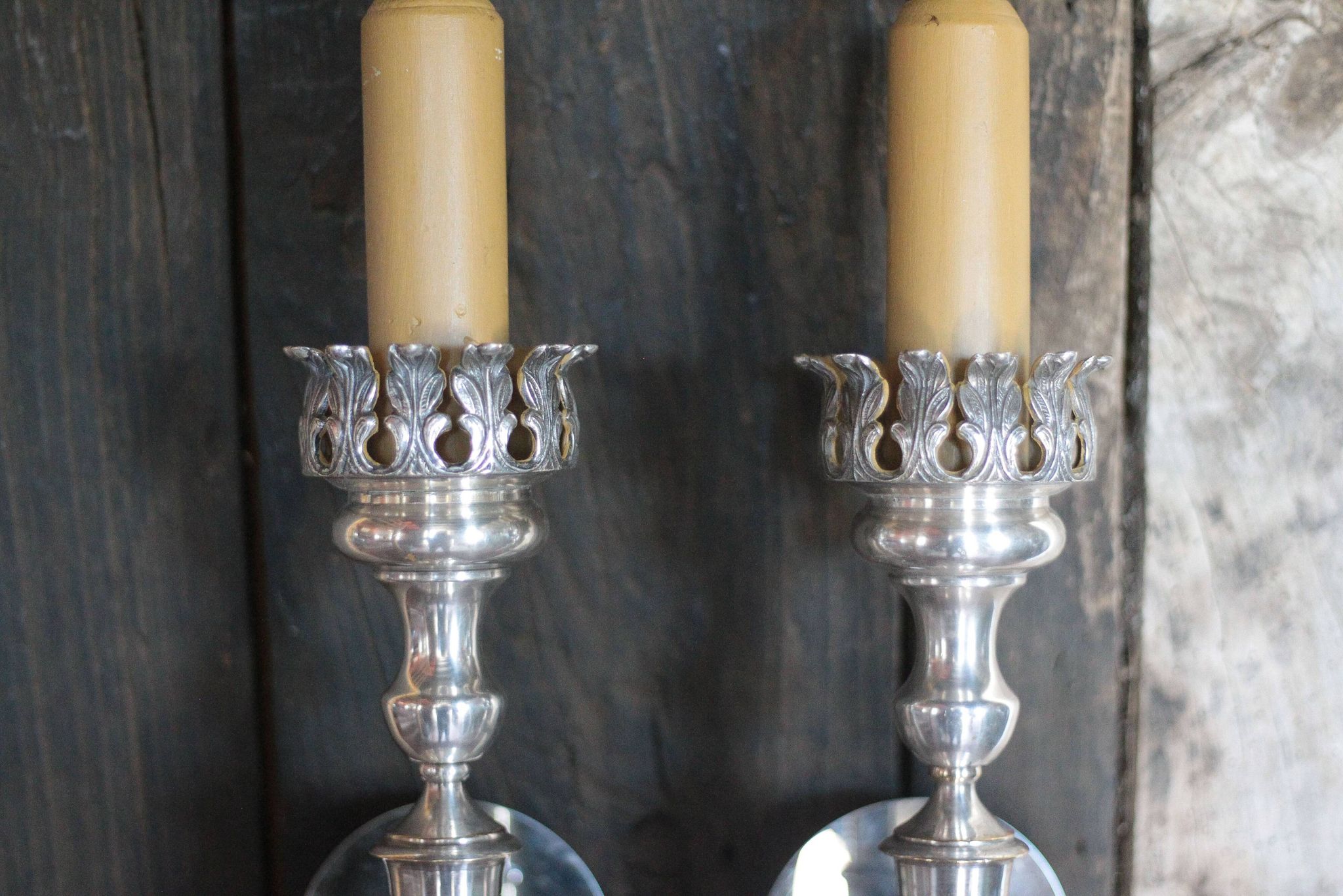 Large pair of silver-plated wall lights with flame globes, torches.