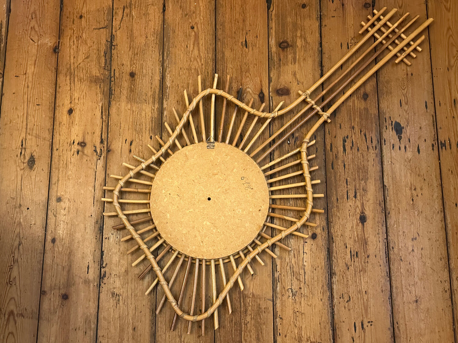 The vintage guitar rattan mirror.
