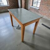 Vintage wooden table with a mint green top.
