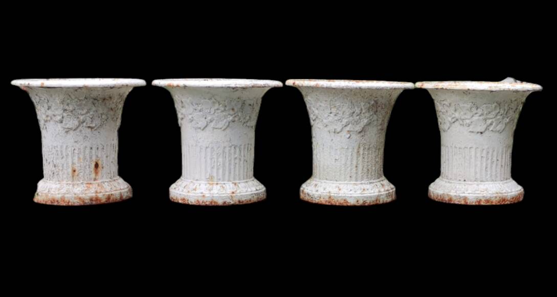 Series of 4 old cast iron vases