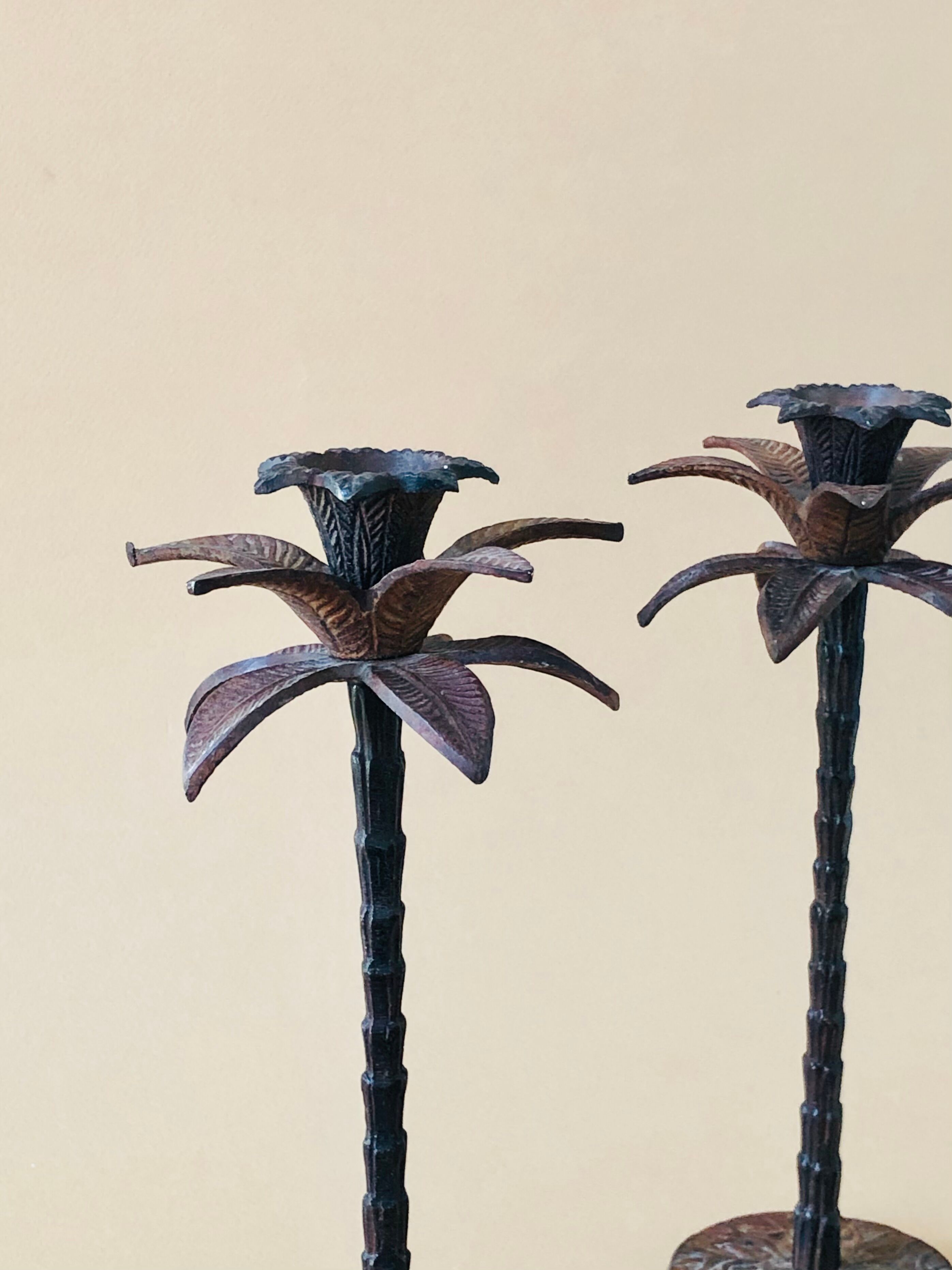 Pair of patinated metal candlesticks