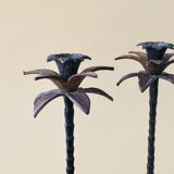 Pair of patinated metal candlesticks