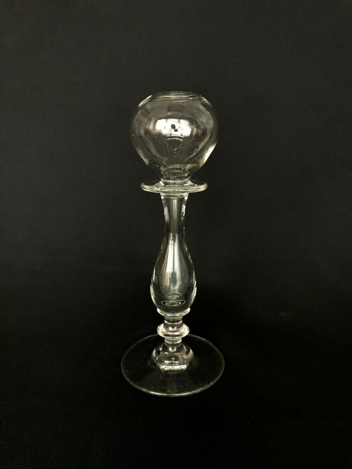 Glass oil lamp blows on foot shower