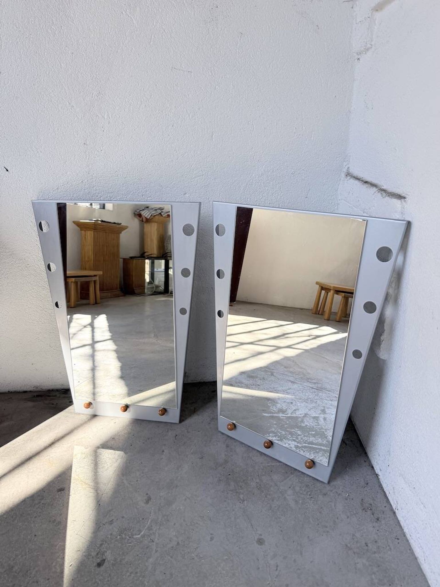 Pair of "Memphis" mirrors from the 80s in chrome and wood.