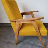 Curly yellow Scandinavian armchair