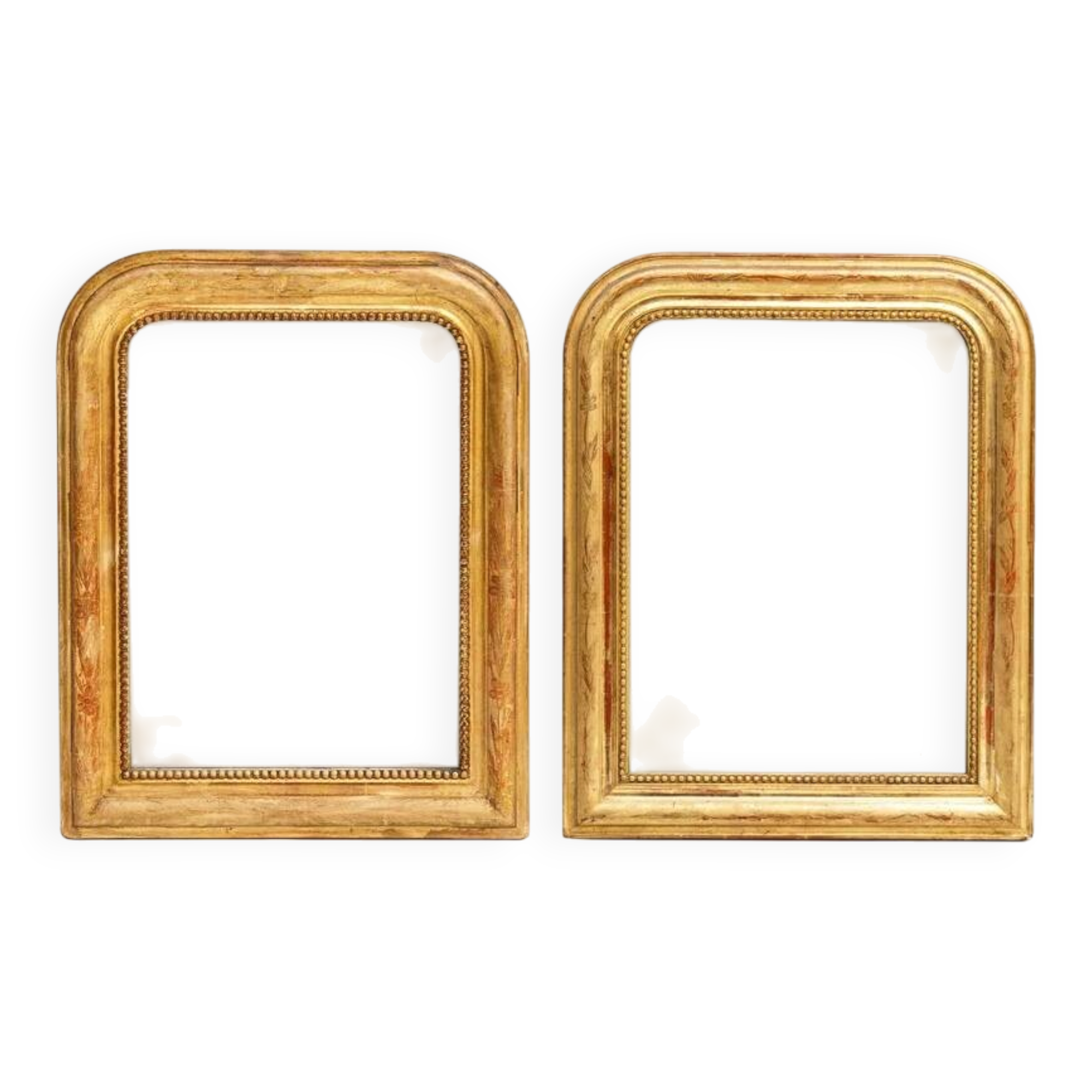 Set of two small French Louis-Philippe gilt red mirrors from the 19th century.