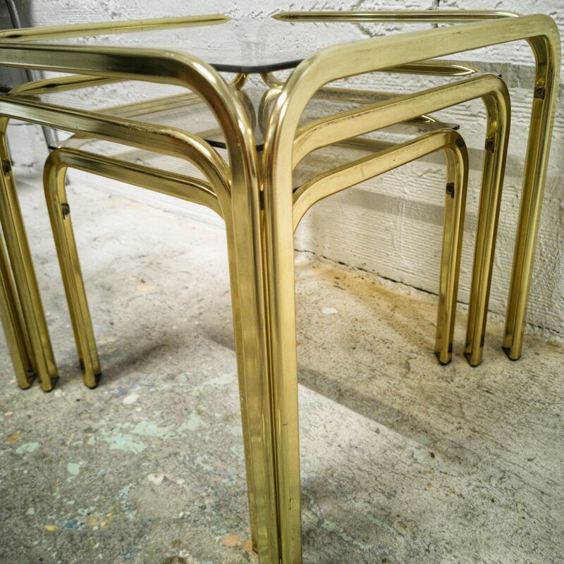 Trio of gilded metal trundle tables