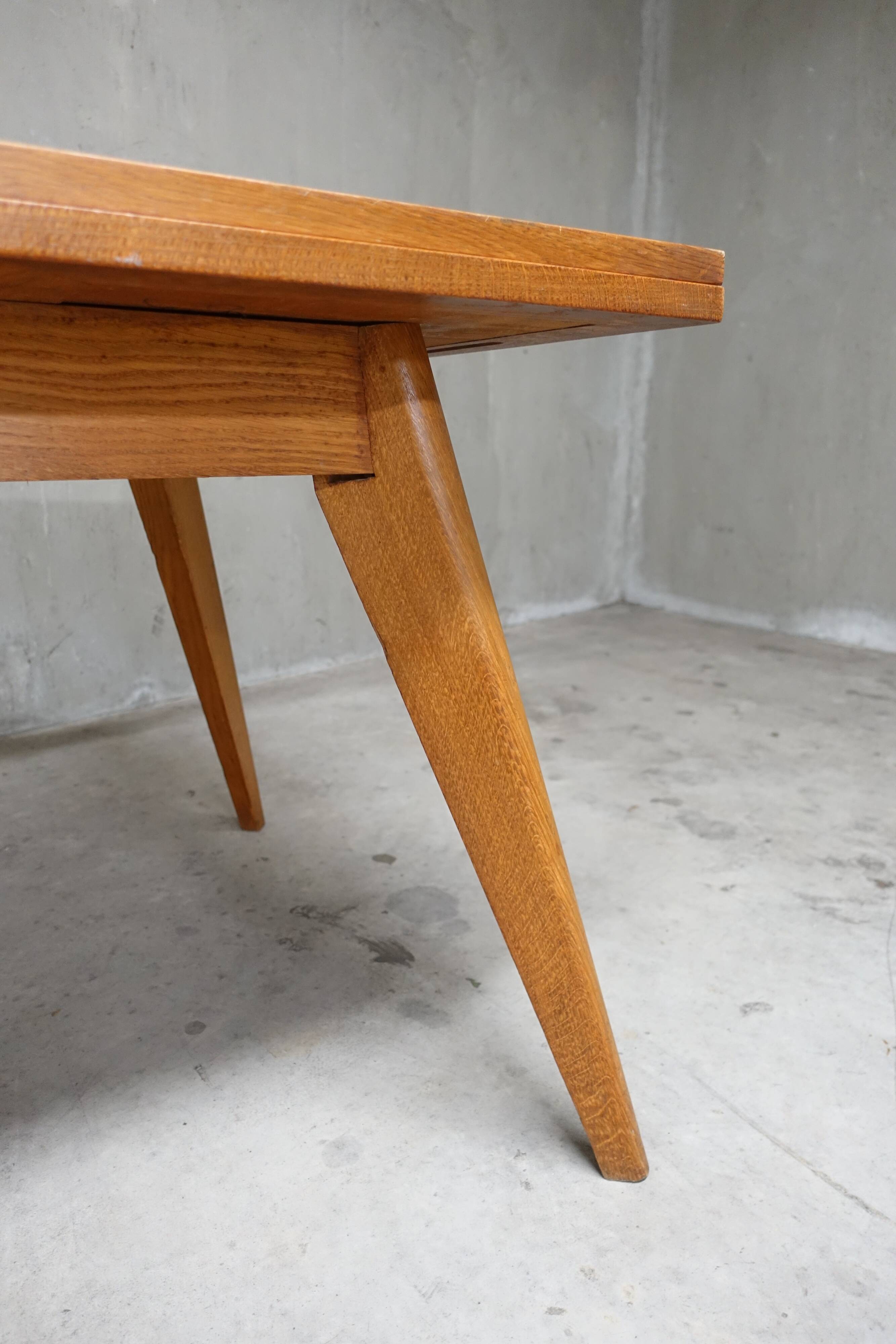 Dining table in blond oak compass feet 1950