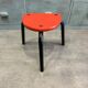 Red tripod stool in industrial style