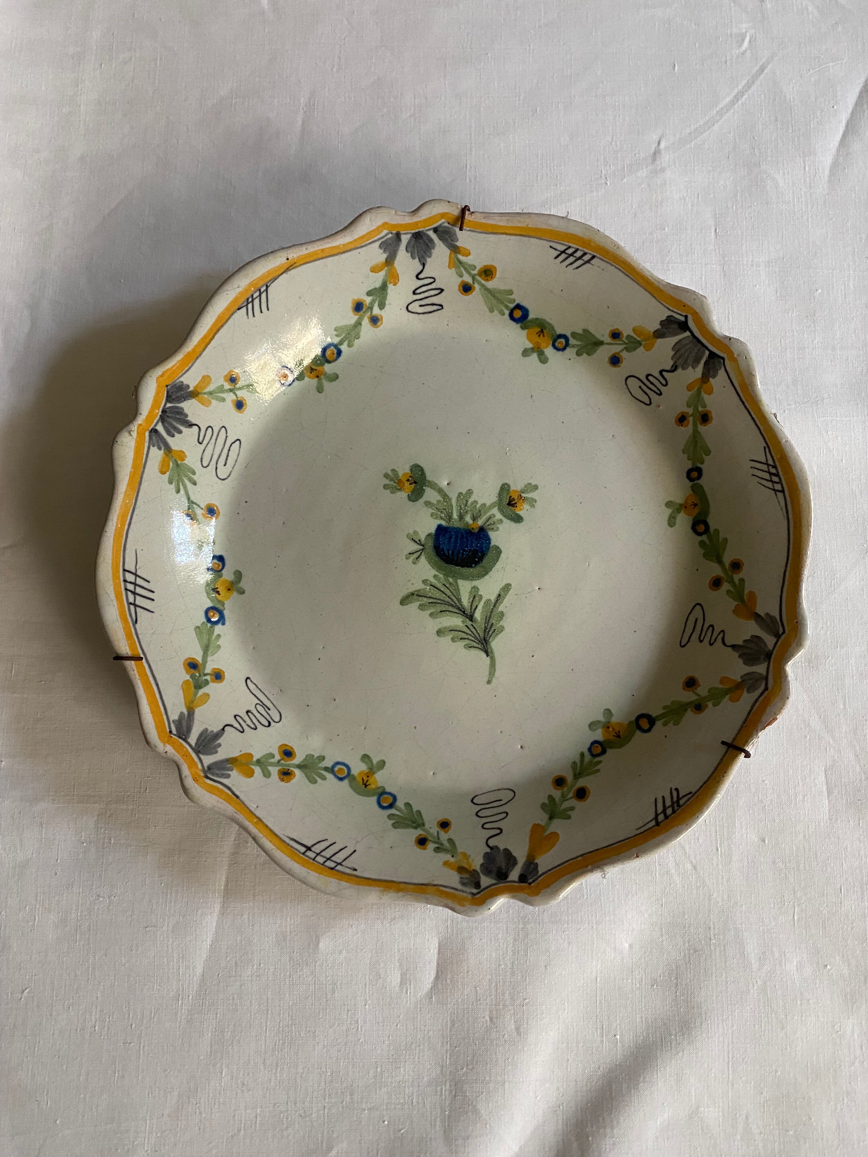 Plate of Nevers in earthenware late eighteenth century decoration of vegetable friezes