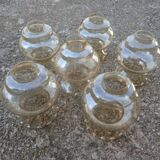 Set of 6 amber glass globes.
