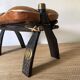 Pair of low Egyptian stools, camel saddles in wood, leather and brass