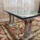 Coffee table with Corinthian columns and glass top