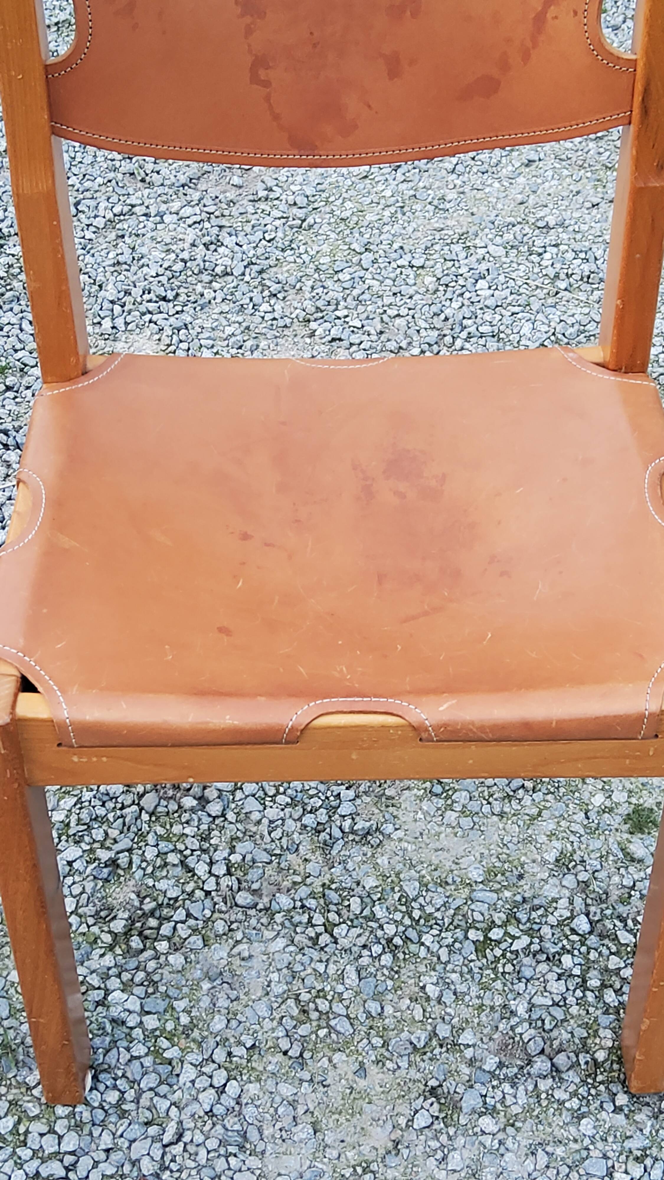 Pair of brutalist chairs in elm and stretched leather with saddle stitching Self publisher