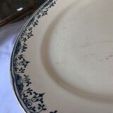 Round serving dish from the Longchamp earthenware factory, Doria model. Iron Land
