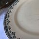Round serving dish from the Longchamp earthenware factory, Doria model. Iron Land