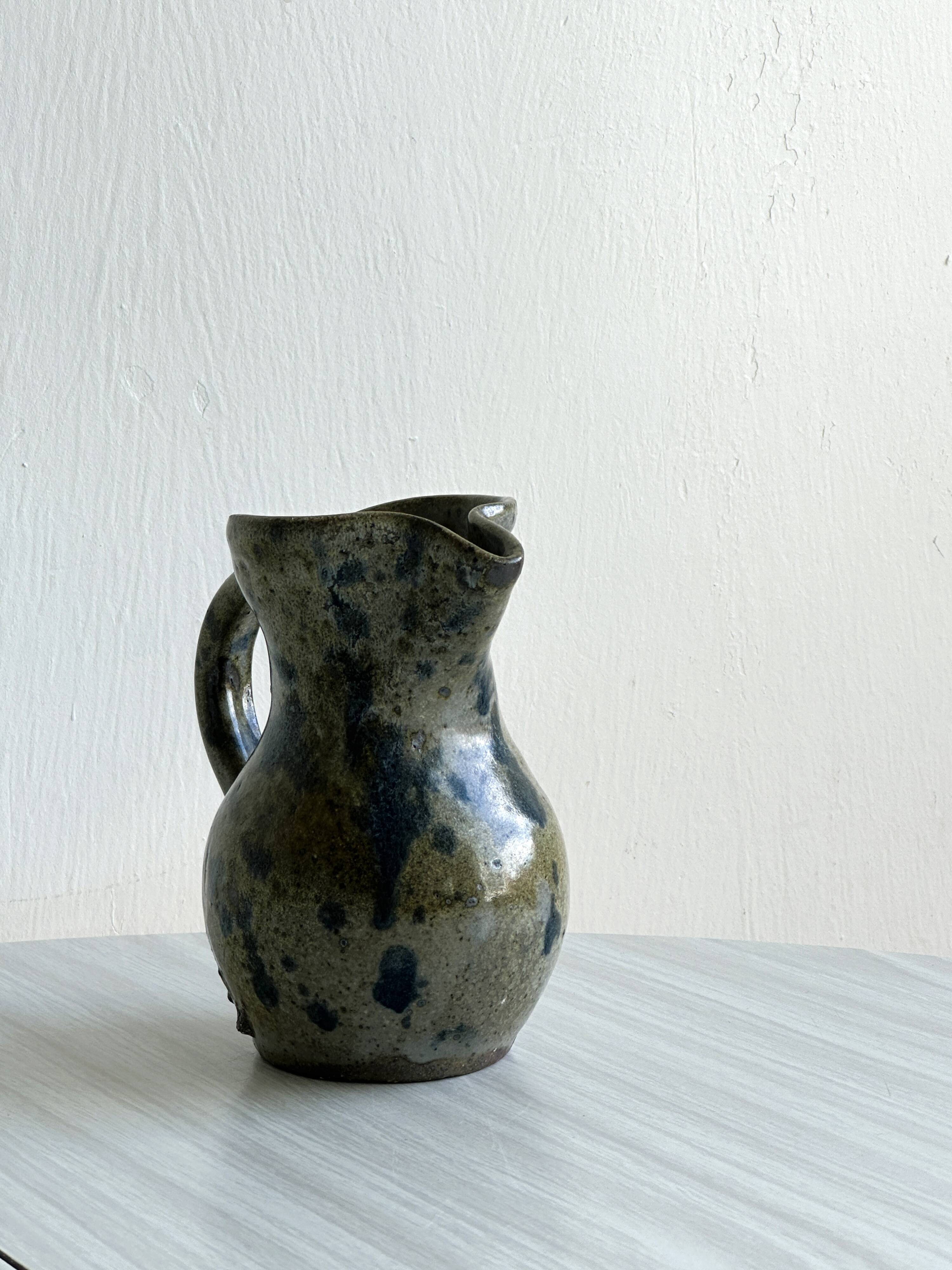 Small vintage enameled stoneware pitcher