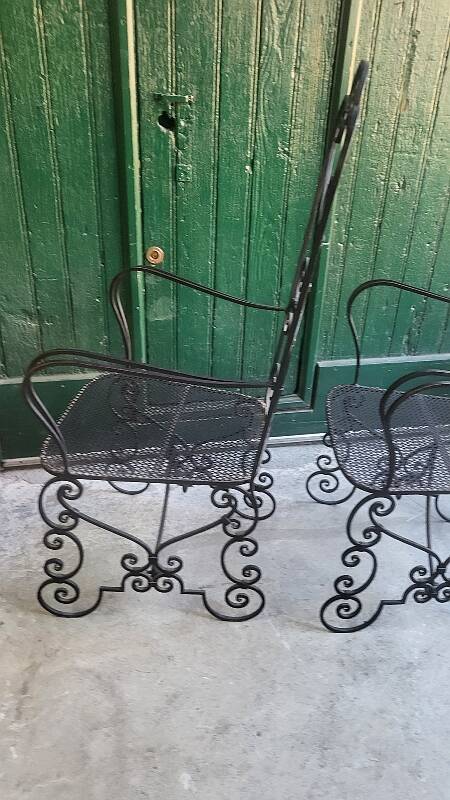 Pair of black wrought iron armchairs