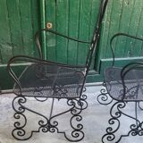 Pair of black wrought iron armchairs