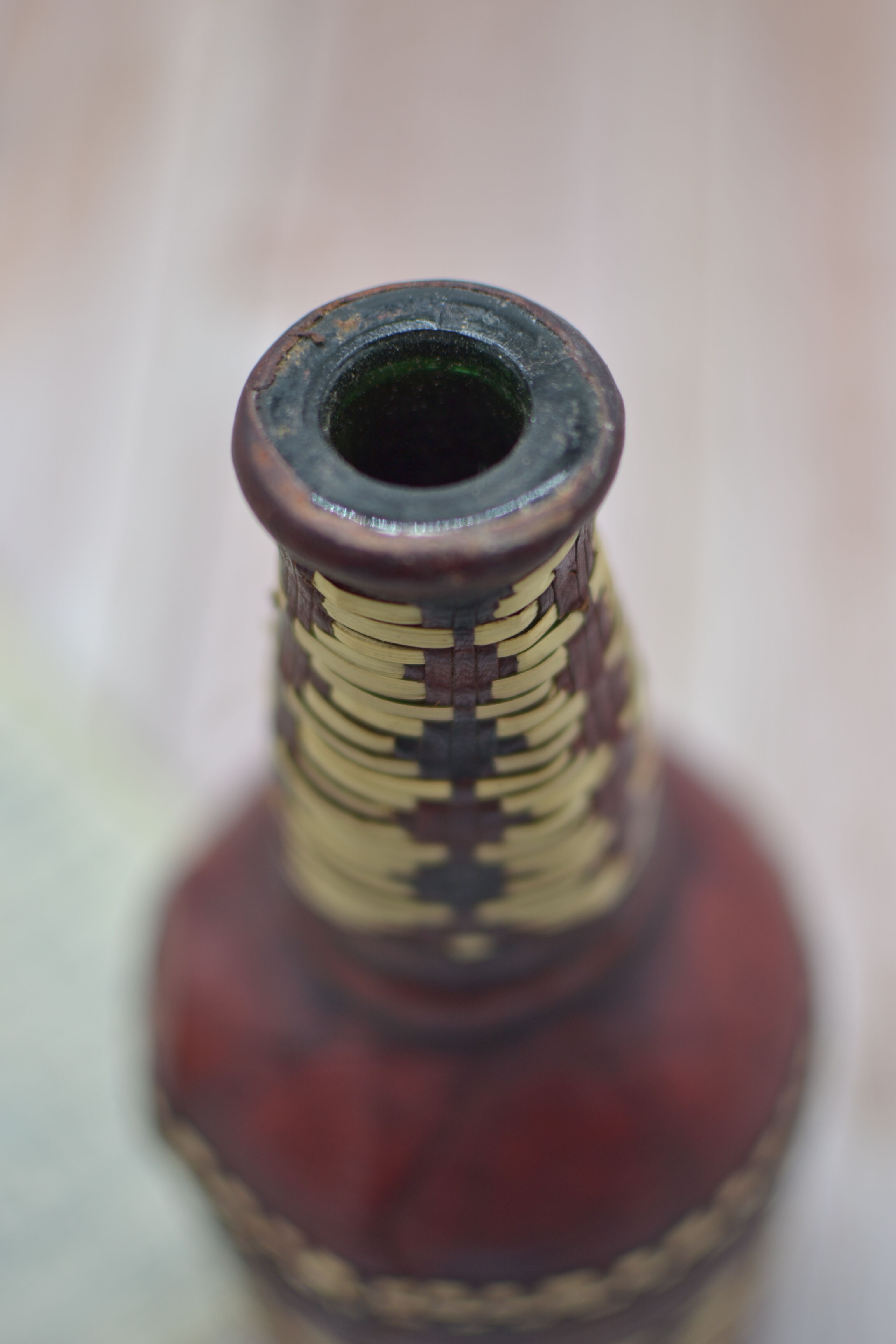 Set of 2 decorative vintage bottles covered with leather & wicker