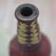 Set of 2 decorative vintage bottles covered with leather & wicker