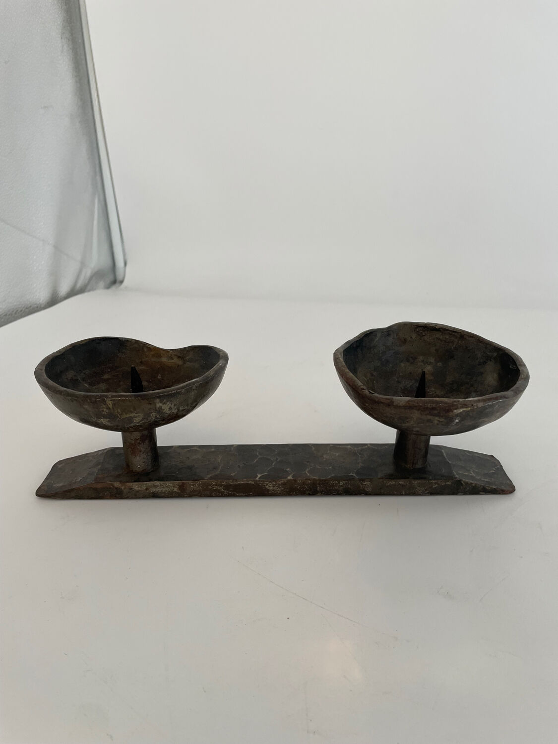 Wrought iron candlestick in brutalist style