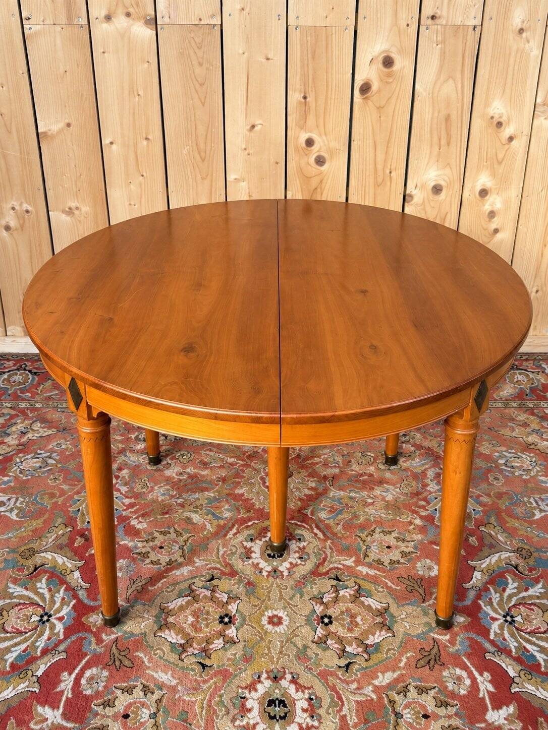 Louis XVI style dining table in cherry wood with extension.