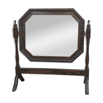 Antique beveled octagonal vanity mirror in carved wood