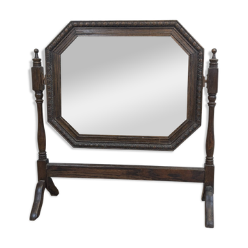 Antique beveled octagonal vanity mirror in carved wood