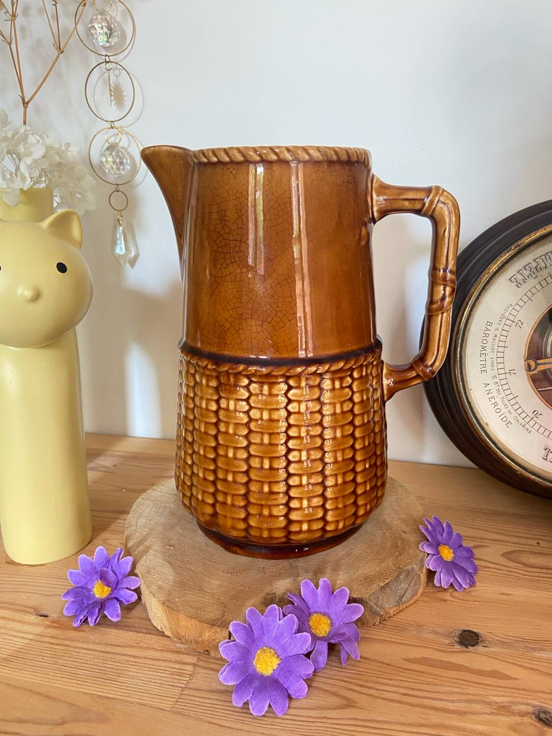 Antique vintage ceramic pitcher or jug from Sarreguemines, France. Brown with a pink interior, imitation basket.
