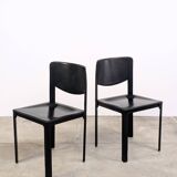 Pair of Matteo Grassi chairs in black saddle leather, 1980s.