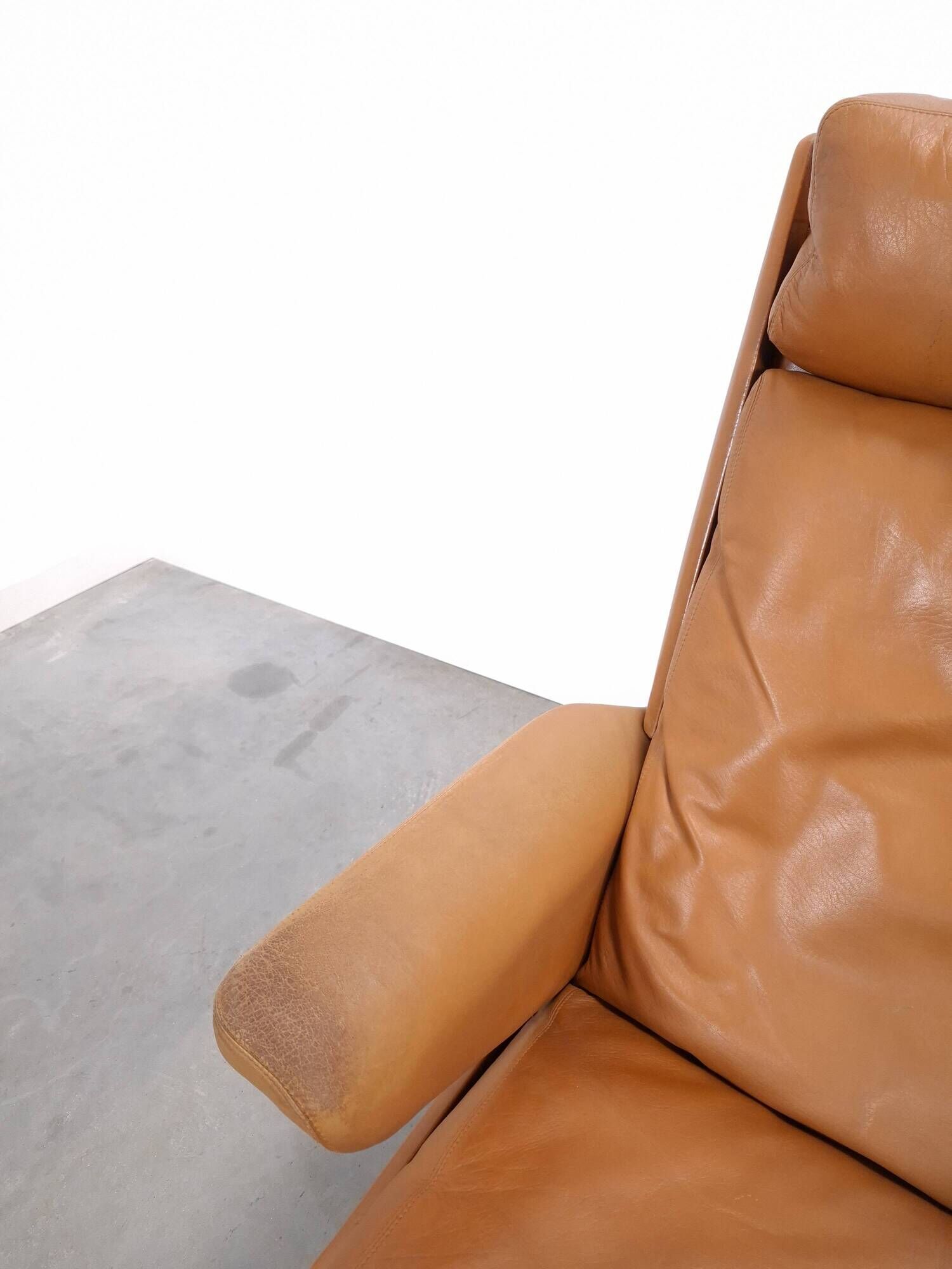 Vintage COR Swing armchair with ottoman, Reinhold Adolf, cognac leather