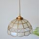 Mother-of-pearl and brass suspension