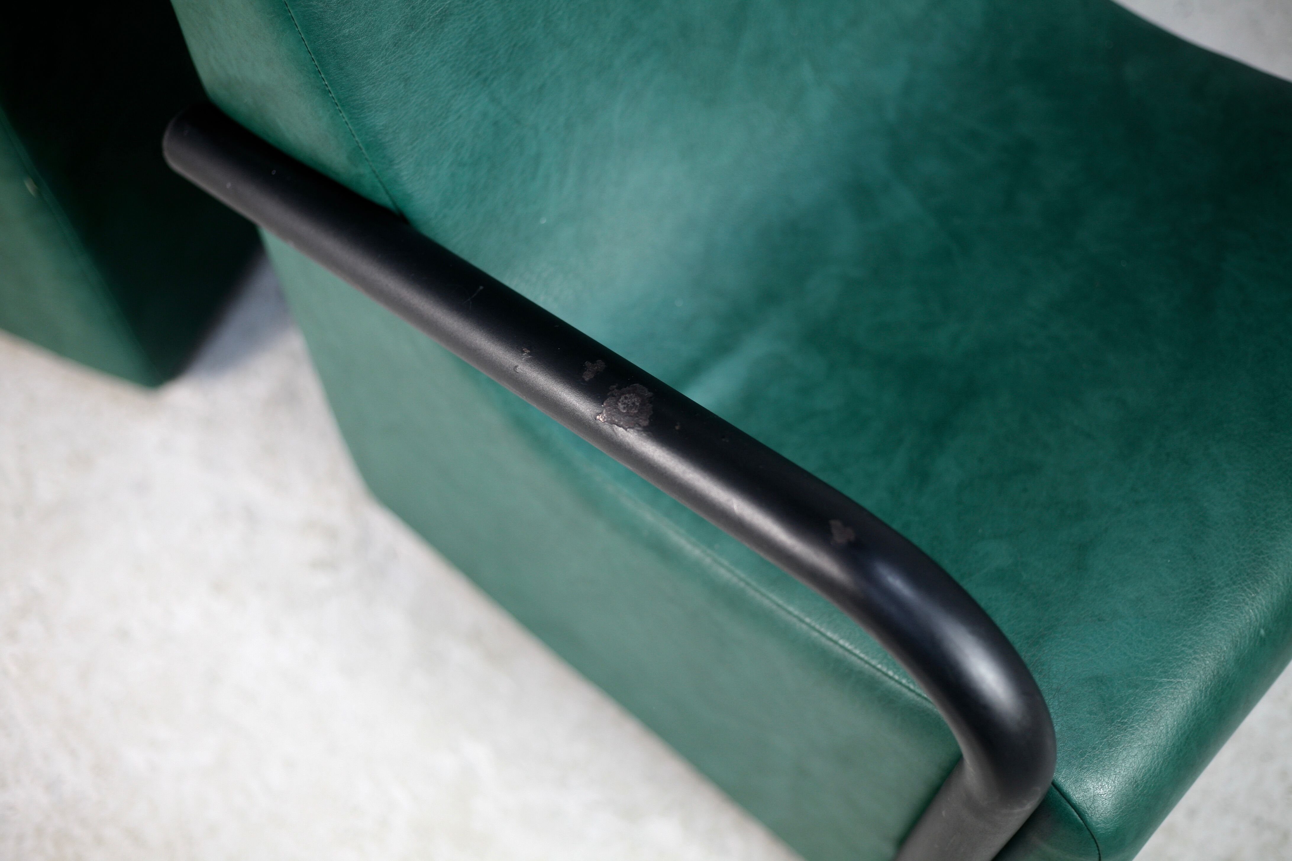 Pair of armrest heaters. Steel and green imitation leather. France, circa 1980