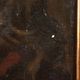 Old painting of a male face in oil on cardboard from the 19th century.