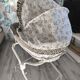 Wicker bassinet on legs