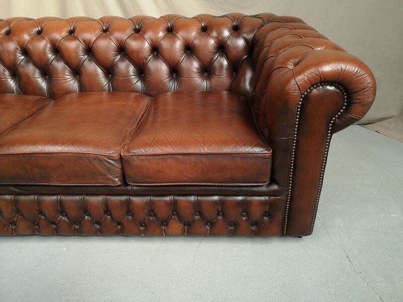 Brown leather chesterfield sofa