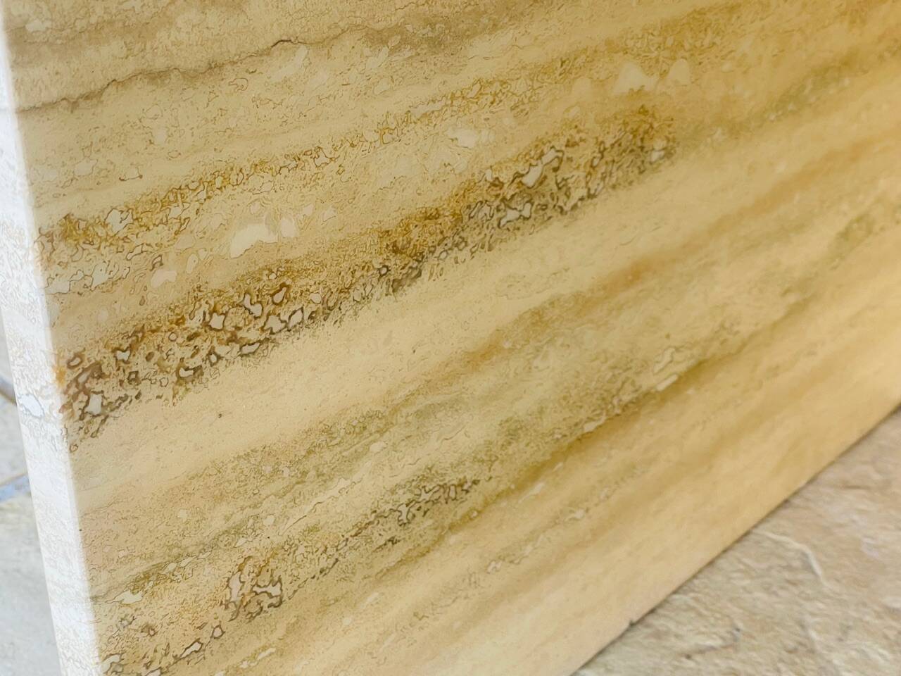 Vintage side table in travertine, circa 1980s.