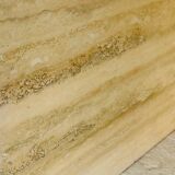 Vintage side table in travertine, circa 1980s.