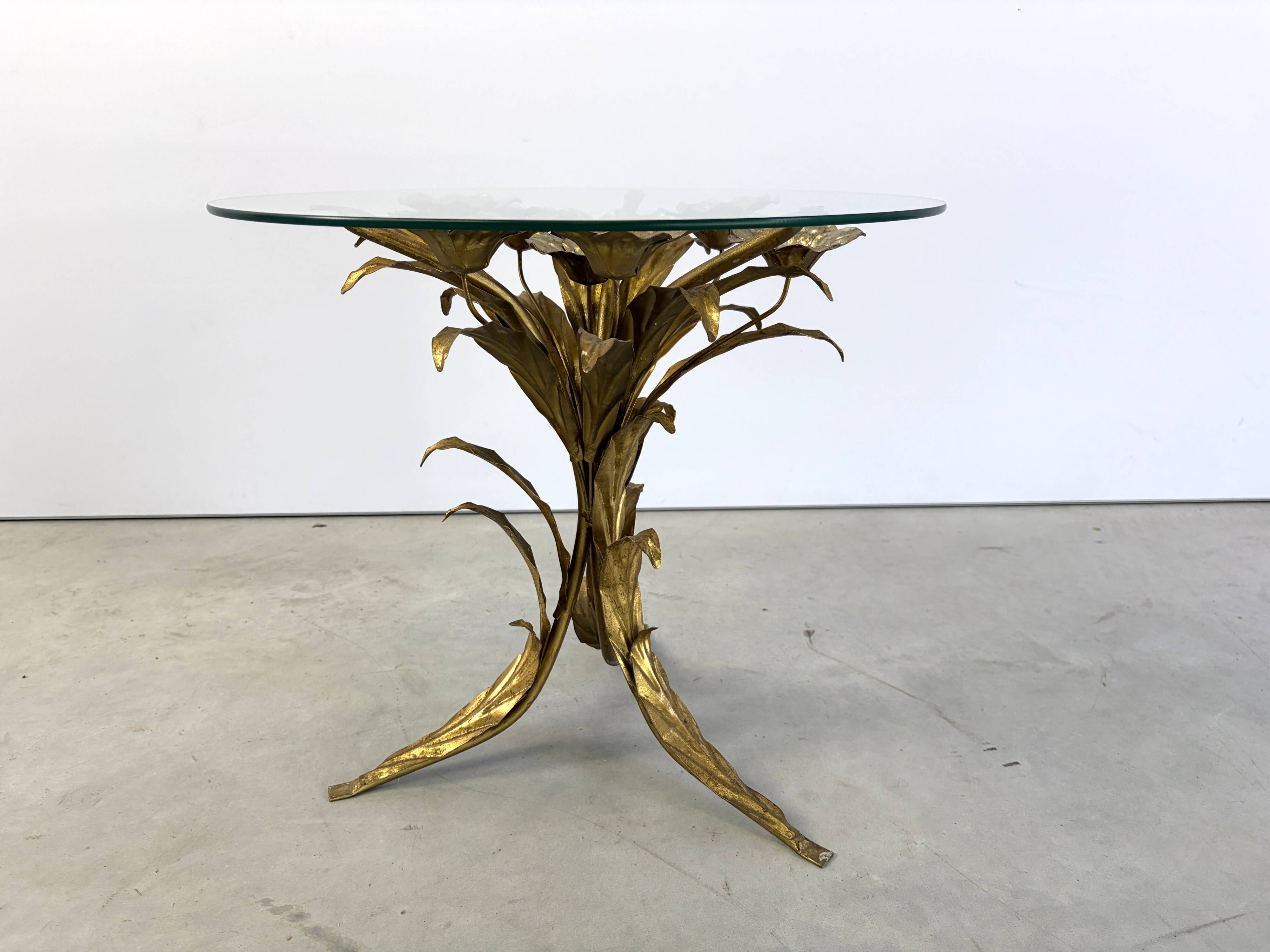 Charming metal flower coffee table or side table with a clear glass top. Made in Italy, attributed to Hans Kögl.