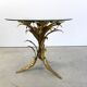 Charming metal flower coffee table or side table with a clear glass top. Made in Italy, attributed to Hans Kögl.