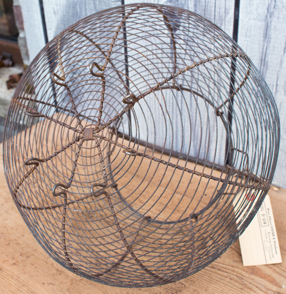 Old basket has wire eggs