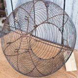 Old basket has wire eggs