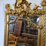 Mirror with an angel in gilded wood and stucco 166x61cm
