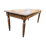 Old French farmhouse table in walnut with turned legs.