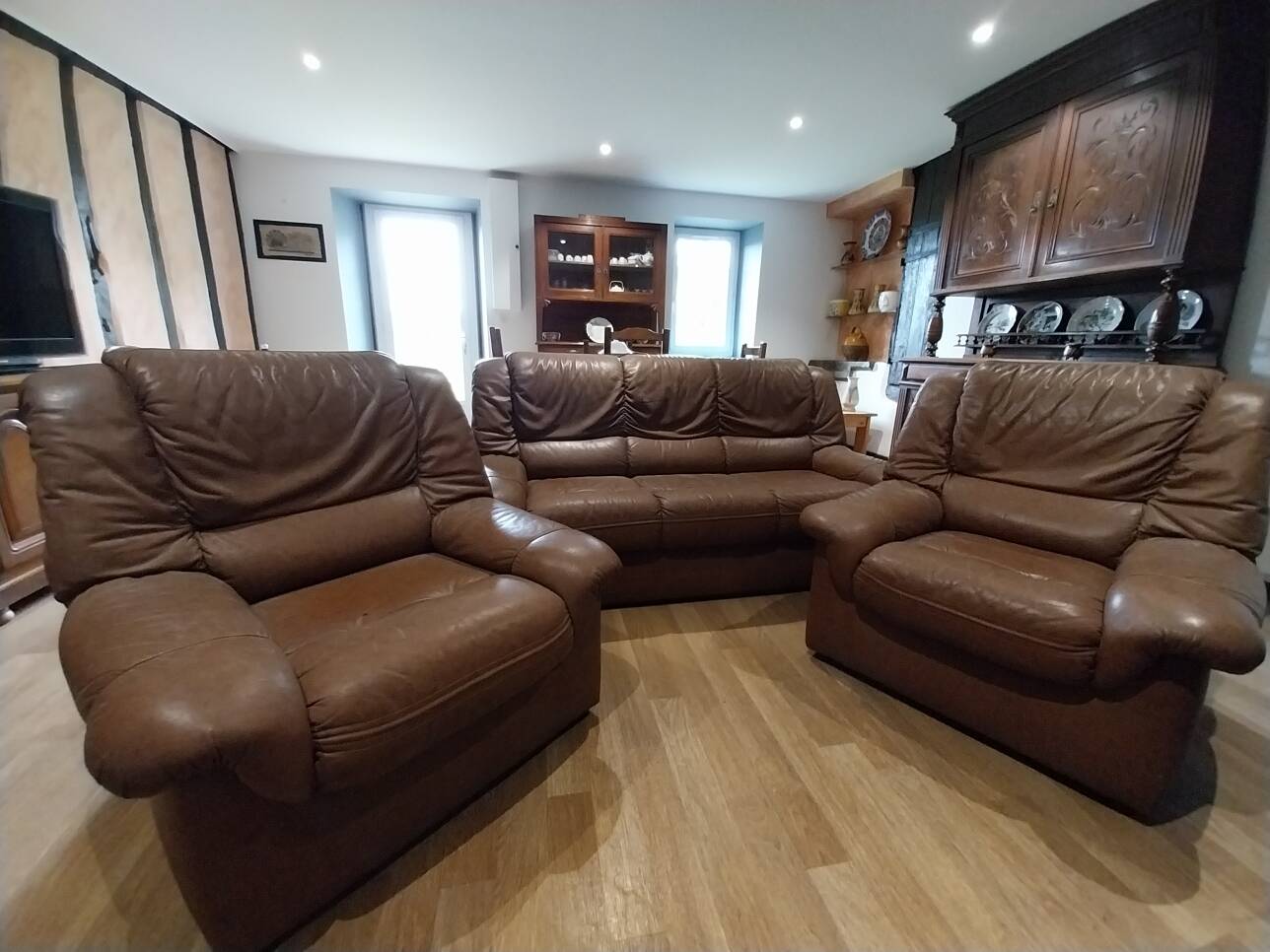 three-seater sofa and two armchairs