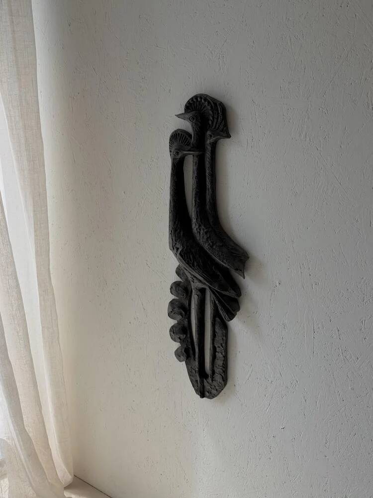 Brutalist wall sculpture with birds Ars Munda