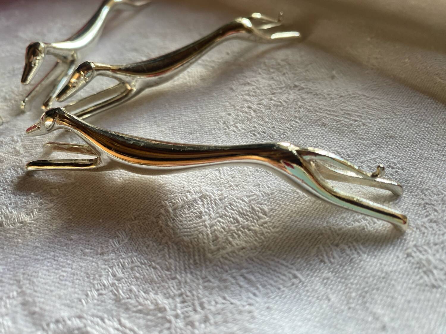 Set of 6 greyhound knife holders in silver metal
