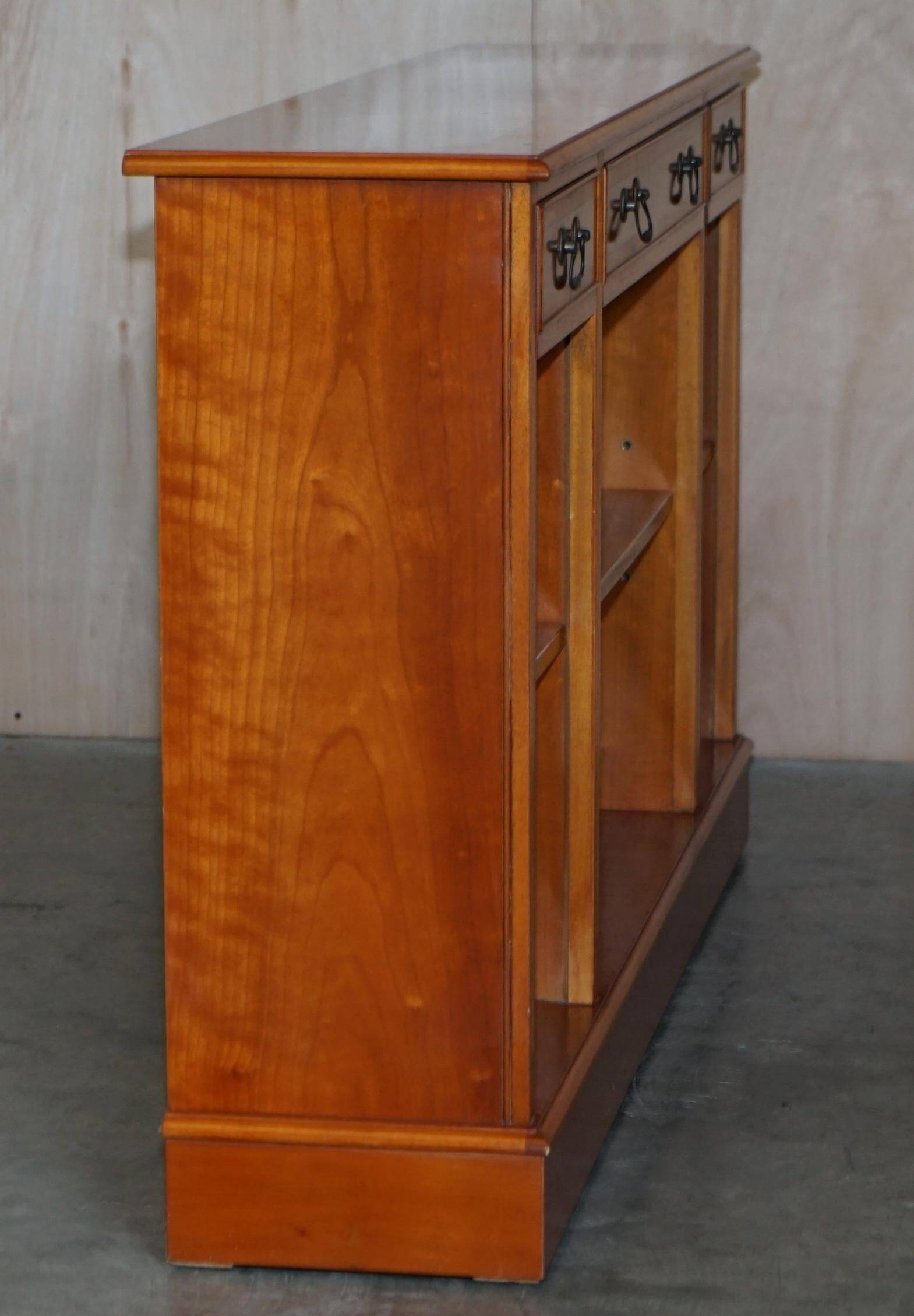 Vintage yew wood library/buffet with three drawers.